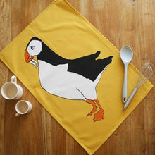 Load image into Gallery viewer, Puffin Tea towel with Yellow background
